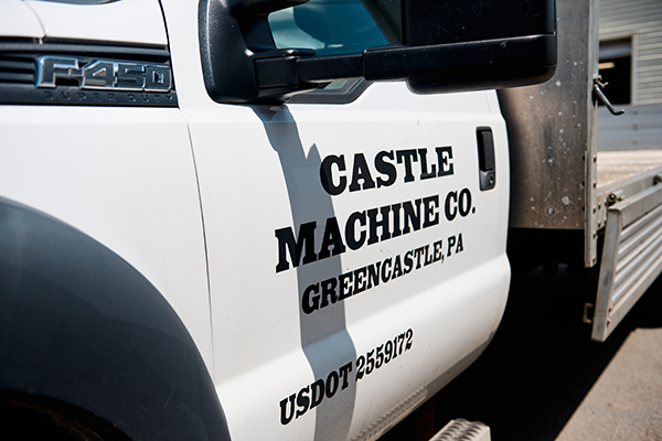 Truck door with Castle Machine Company name